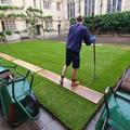 The lawn at Lincoln College while Parks team undertake restoration work