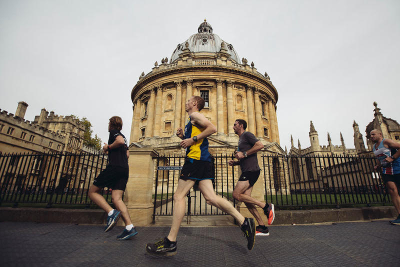 Runners pass the Radcliffe Camera during the 2018 Oxford Half Marathon